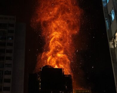 Massive fire in Hong Kong multistorey buildings with smoke and rescue operations in progress