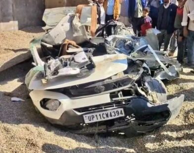 Overturned dumper lying on top of a crushed car after a tragic accident killing seven family members