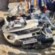 Overturned dumper lying on top of a crushed car after a tragic accident killing seven family members