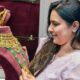 Woman checking gold jewellery at a shop
