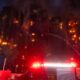 Smoke rising from high-rise buildings in Hong Kong after a massive fire with rescue teams at the scene