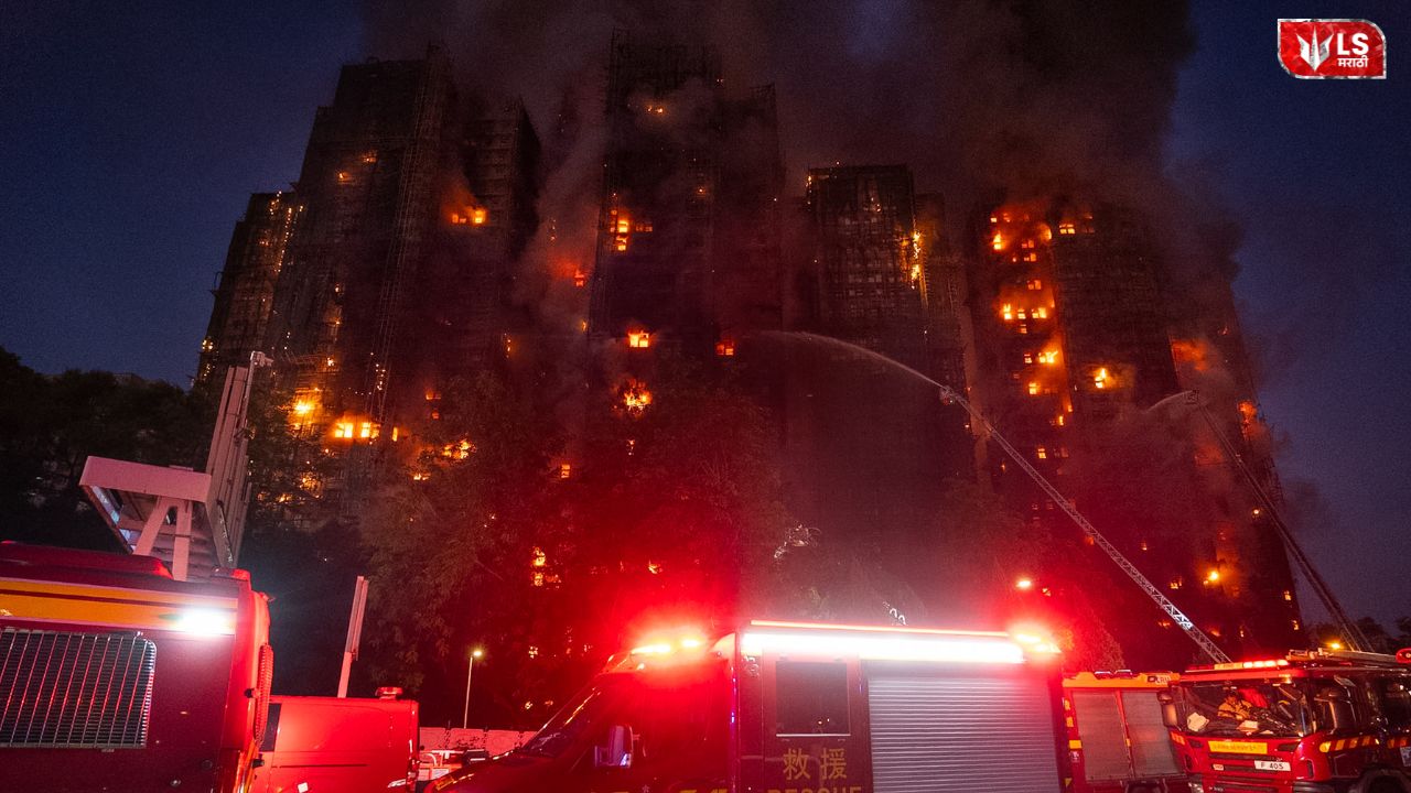 Smoke rising from high-rise buildings in Hong Kong after a massive fire with rescue teams at the scene