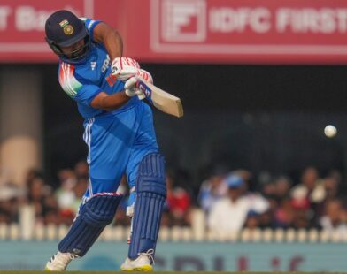 Rohit Sharma celebrating after hitting a six, marking his world record for the most sixes in ODI cricket
