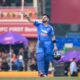Virat Kohli celebrating after scoring a record-breaking century in the Ranchi ODI, achieving multiple cricket records