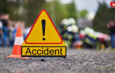 Scene of a serious road accident on the Dhule–Solapur Highway showing damaged vehicles, with reports of one person dead and another critically injured