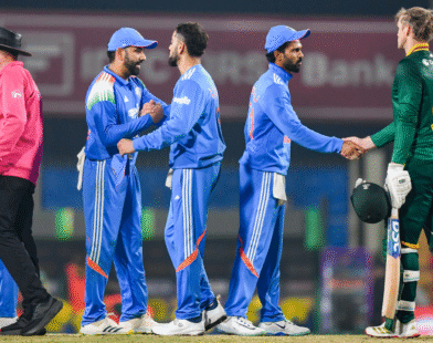 Rohit Sharma and Virat Kohli standing on the cricket field ahead of the India vs South Africa 2nd ODI match
