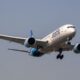 IndiGo aircraft at the airport with passengers affected by flight cancellations and refund delays