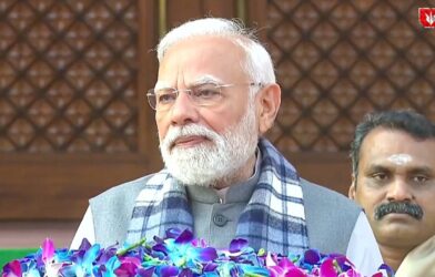 Prime Minister Narendra Modi arriving at the Indian Parliament during the winter session, greeting members and media
