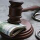 Anti-Corruption Bureau officers in Pune detaining two suspects in an ₹8 crore bribe case