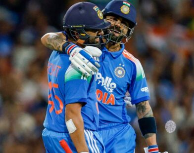 Rohit Sharma and Virat Kohli celebrating on the cricket field after securing top two positions in ICC ODI rankings