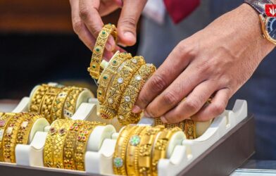 Silver bars and gold coins representing the latest record-breaking price surge