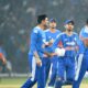 Indian cricket players celebrating after defeating South Africa in the first T20 match, with South Africa getting all out for 74 runs