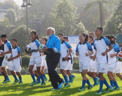 PM Modi football with children
